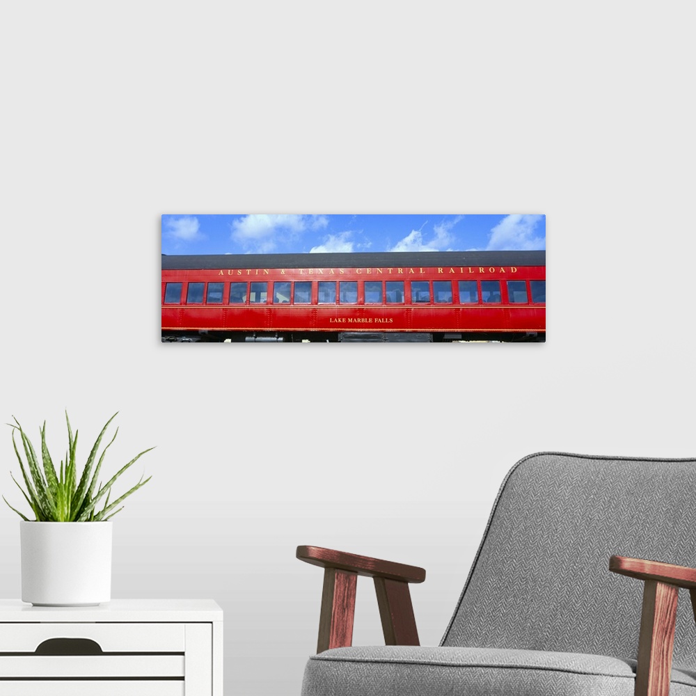 A modern room featuring 'Historic red passenger car, Austin & Texas Central Railroad'