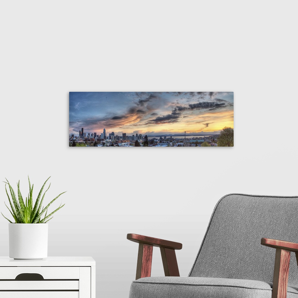 A modern room featuring Downtown Seattle skyline, Olympic Mountains, and Space Needle at sunset.