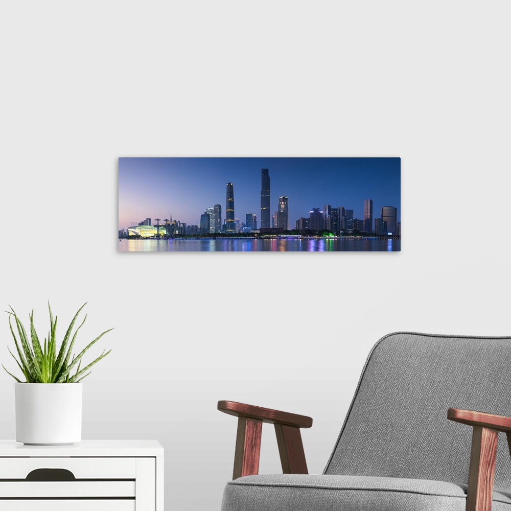 A modern room featuring Skyline of Tianhe at dusk, Guangzhou, Guangdong, China.