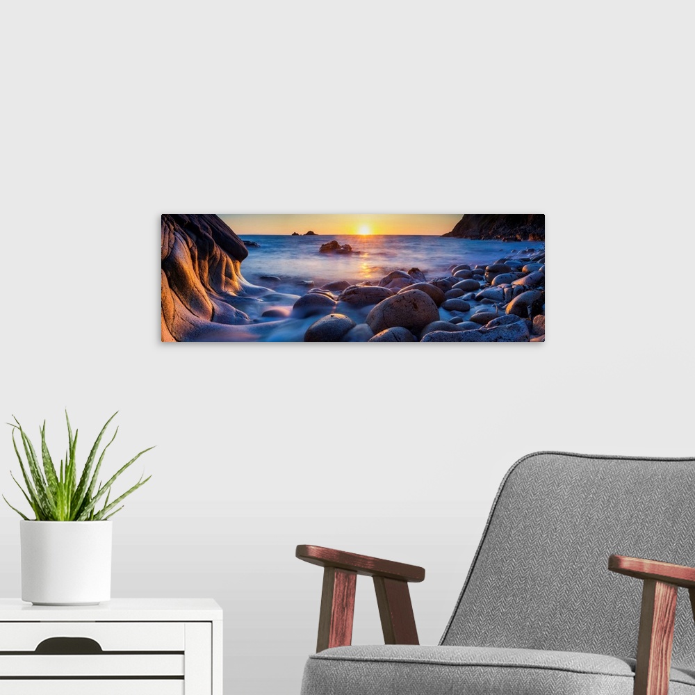 A modern room featuring Sunset at Porth Navan, Cornwall, England.
