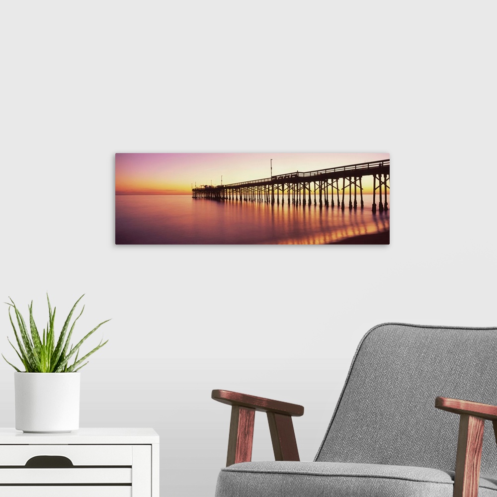 A modern room featuring Balboa Pier at sunset, Newport Beach, Orange County, California, USA