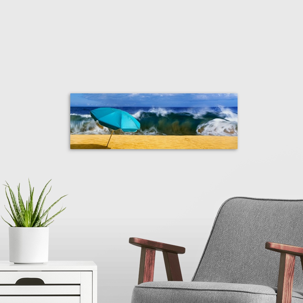 A modern room featuring Beach umbrella with waves in the background, halawa beach park, halawa bay, island of molikai, ha...