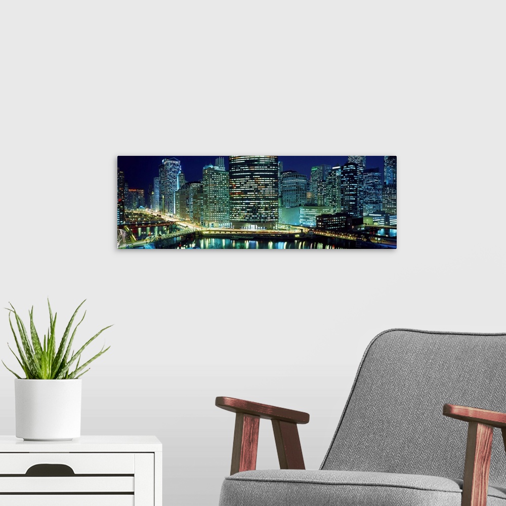 A modern room featuring Chicago skyline at night, Chicago, Cook County, Illinois, USA