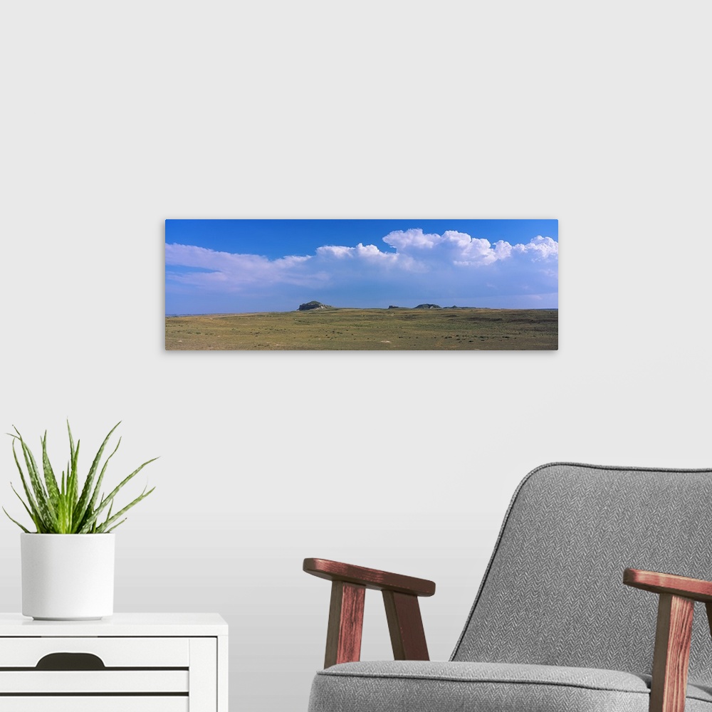 A modern room featuring Clouds over a landscape, Castle Rock, Scotts Bluff County, Nebraska,