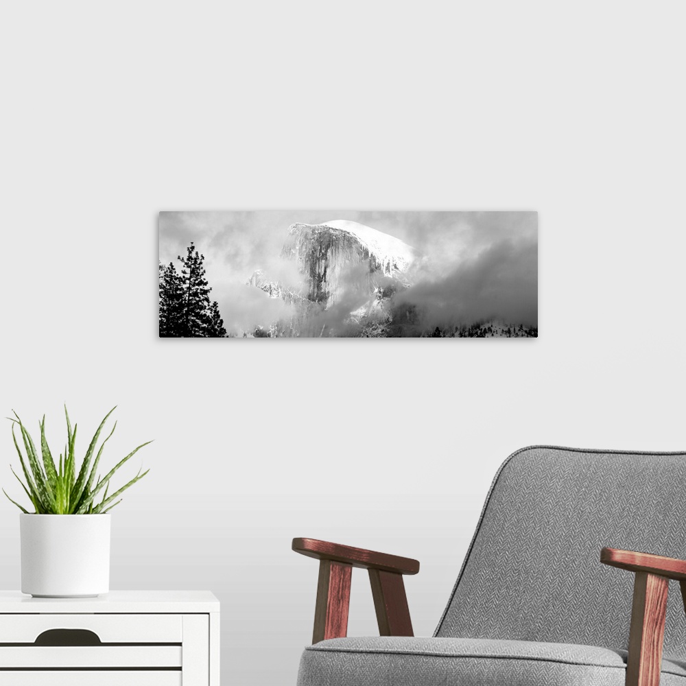 A modern room featuring Low Angle View Of A Mountain Covered With Snow, Half Dome, Yosemite National Park, California, USA.