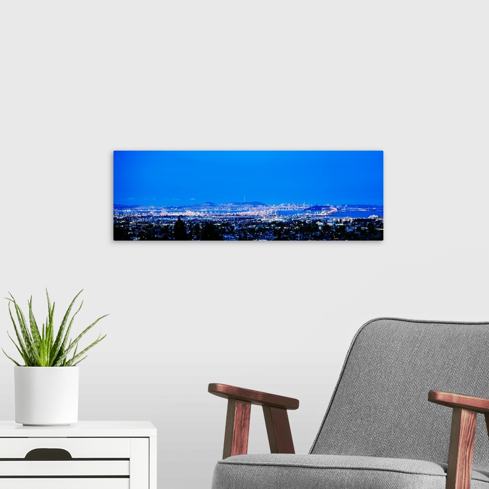 A modern room featuring High angle view of a city at dusk, San Francisco, California, USA
