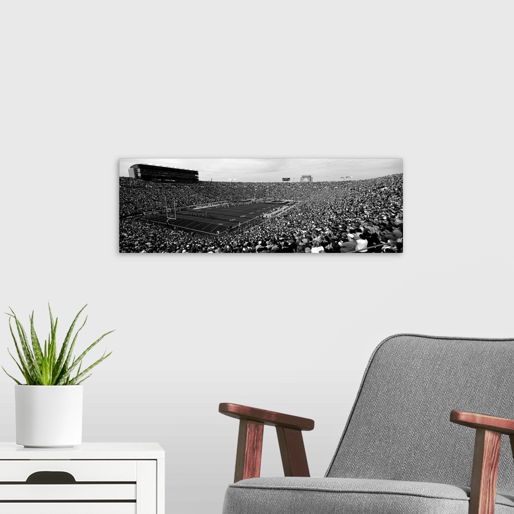 A modern room featuring High angle view of a football stadium full of spectators, Notre Dame Stadium, South Bend, Indiana...