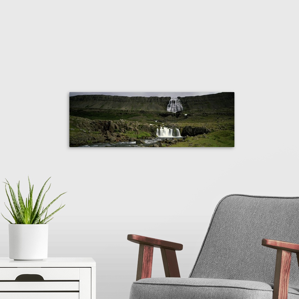 A modern room featuring Landscape with waterfall and stream, Iceland