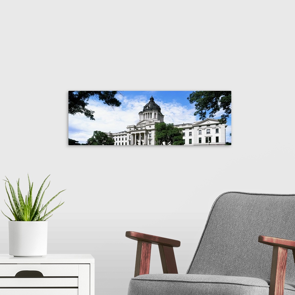 A modern room featuring Low angle view of a government building, South Dakota State Capitol, Pierre, South Dakota, USA.