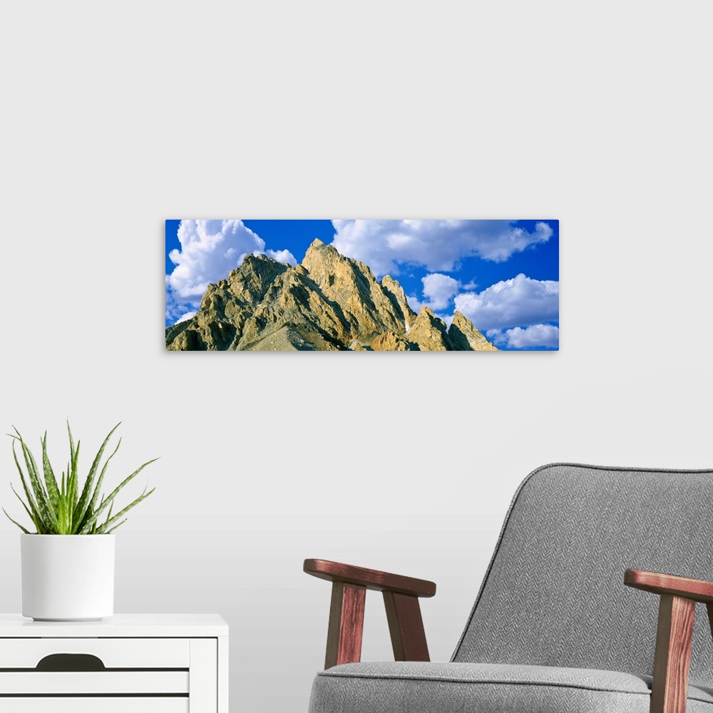 A modern room featuring Low angle view of clouds over mountain peak, Exum Ridge, Grand Teton National Park, Wyoming, USA.