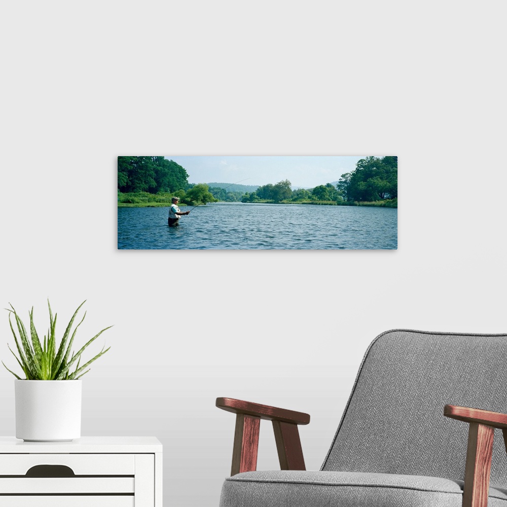 A modern room featuring Man fly-fishing in a river, Delaware River, Deposit, Broome County, New York State, USA