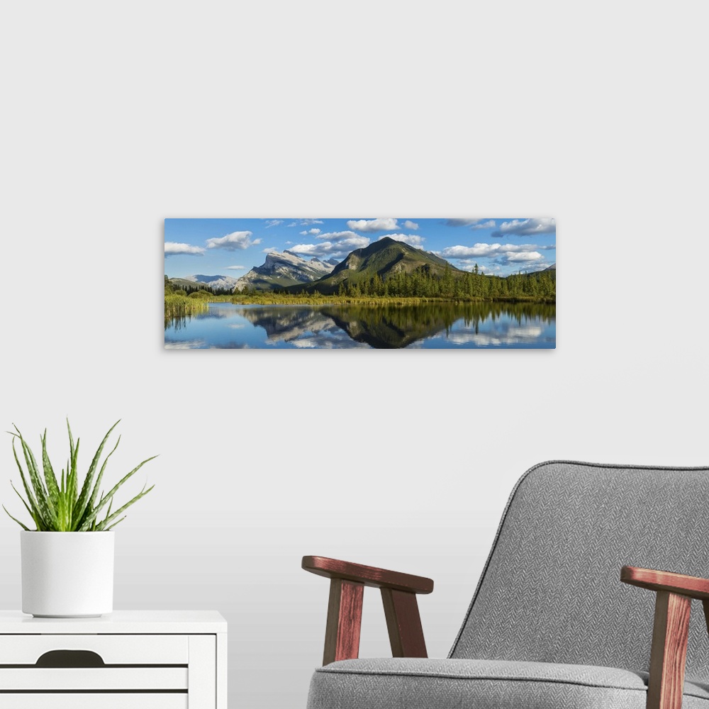 A modern room featuring Mount Rundle and Sulphur Mountain reflecting in Vermilion Lake, Canada