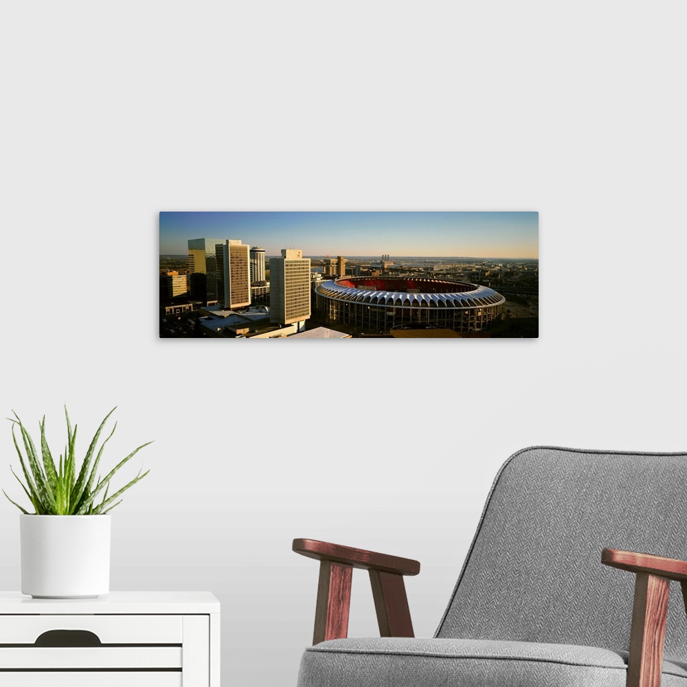 A modern room featuring Panoramic view of Busch Stadium and Kansas City skyline at sunset, MO