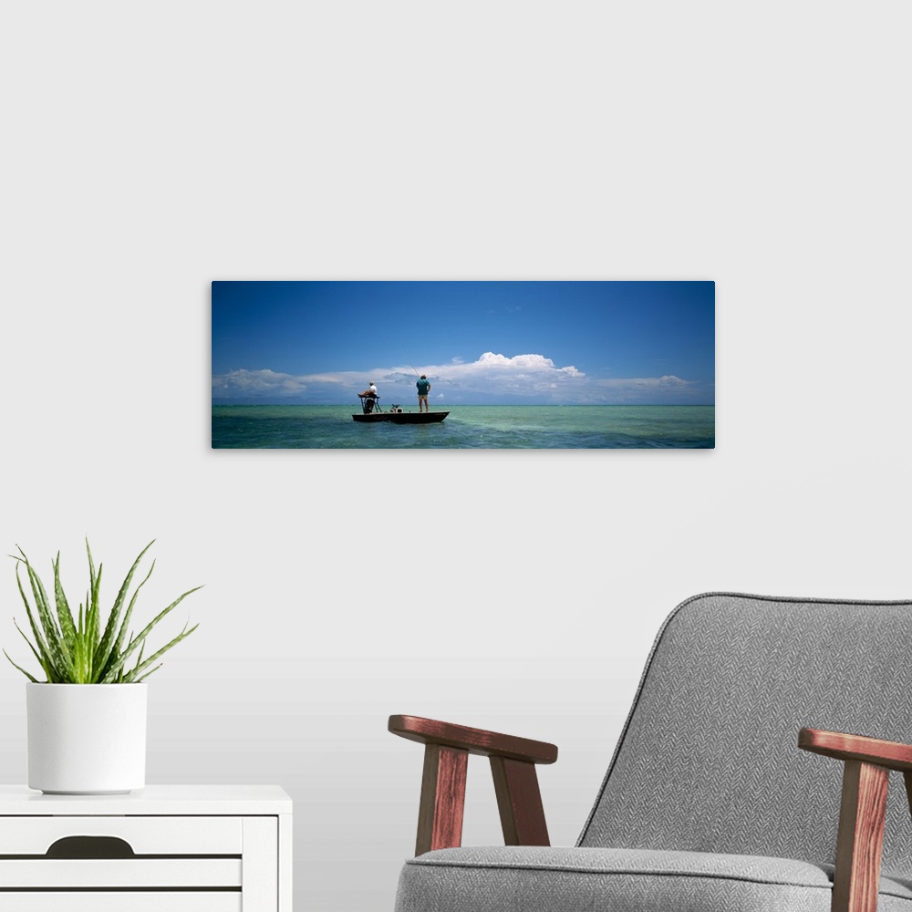 A modern room featuring Rear view of a couple fishing in the sea, Islamorada, Florida Keys, Monroe County, Florida, USA