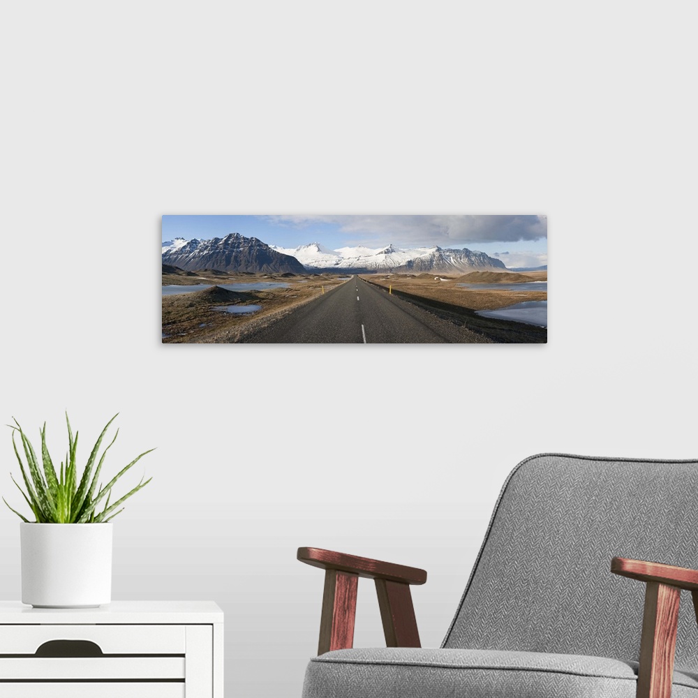 A modern room featuring Road with mountains in the background Iceland