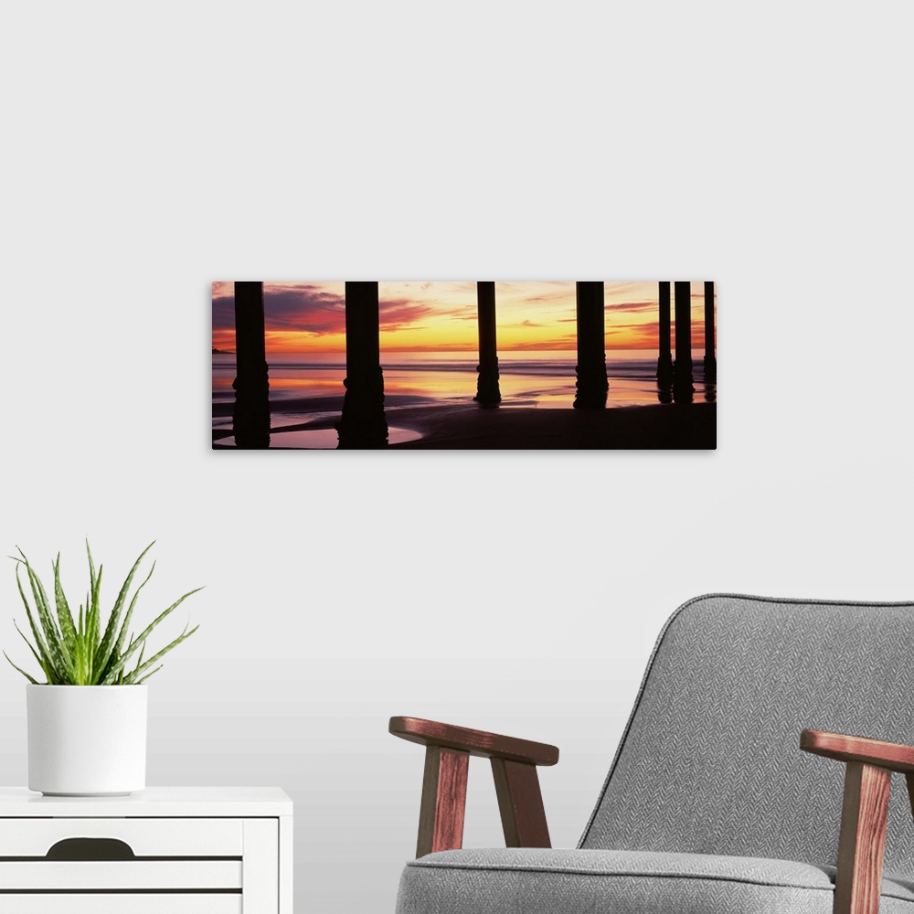 A modern room featuring Silhouette of a pier in the Pacific Ocean at sunset, Scripps Pier, La Jolla, San Diego, California