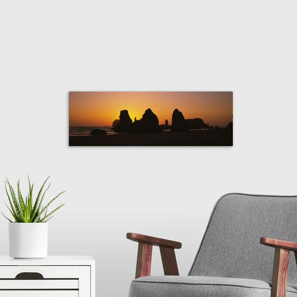 A modern room featuring Silhouette of rock formations at sunset, Pacific Ocean, Bandon State Natural Area, Bandon, Oregon