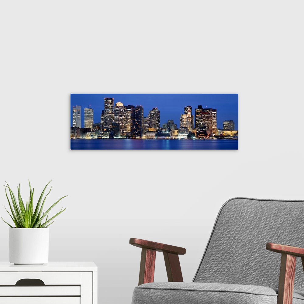 A modern room featuring Skyscrapers lit up at night, Boston, Massachusetts, New England, USA