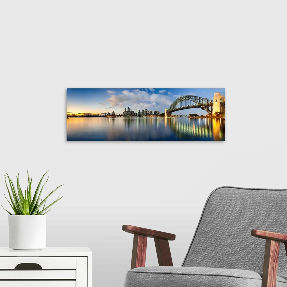 A modern room featuring Sydney Harbour Bridge and skylines at dusk, Sydney, New South Wales, Australia.