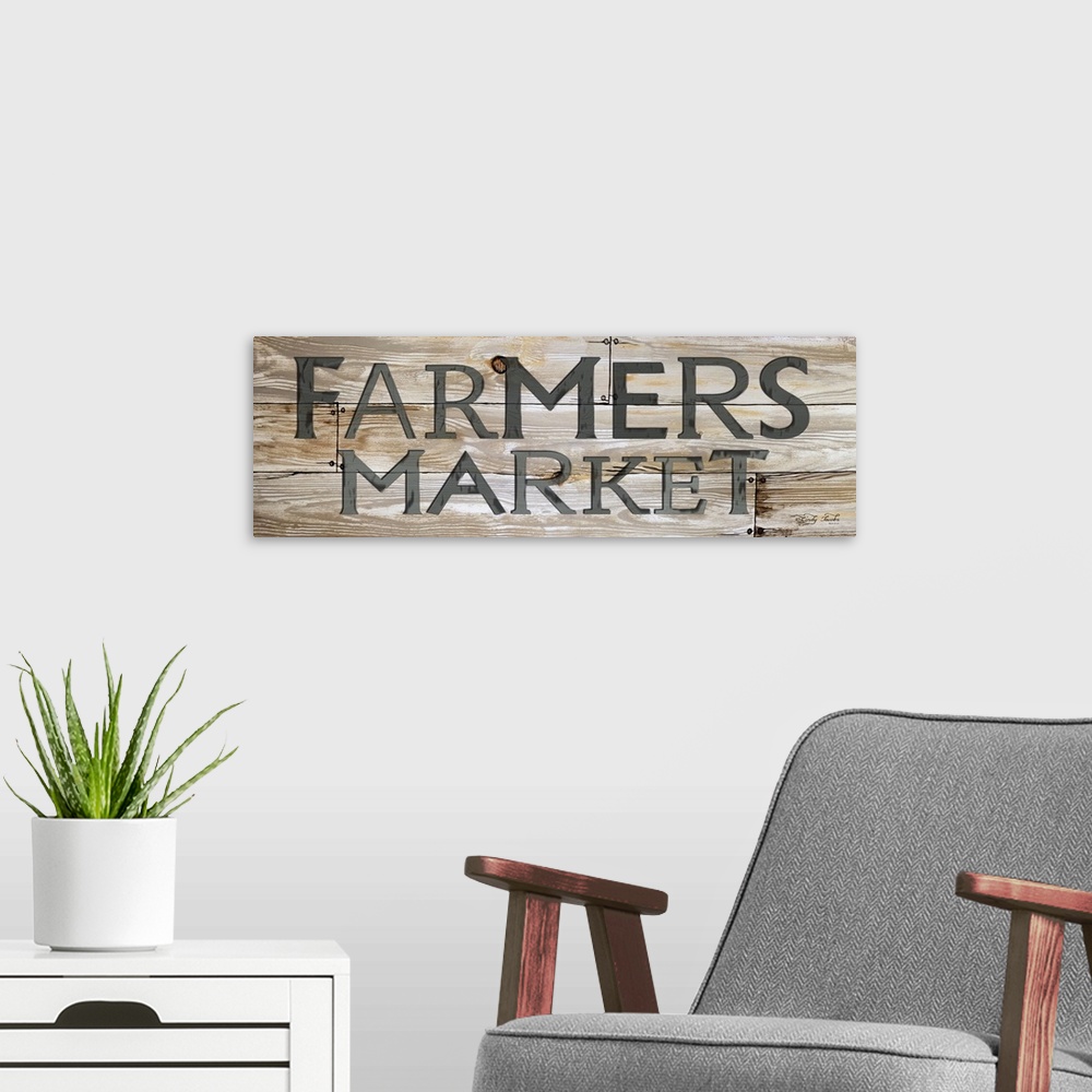 A modern room featuring Vintage style sign for a Farmer's Market with a weathered effect.