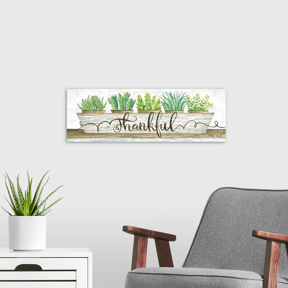 A modern room featuring The word, thankful, is placed over a planter filled with bright green succulents and cacti.