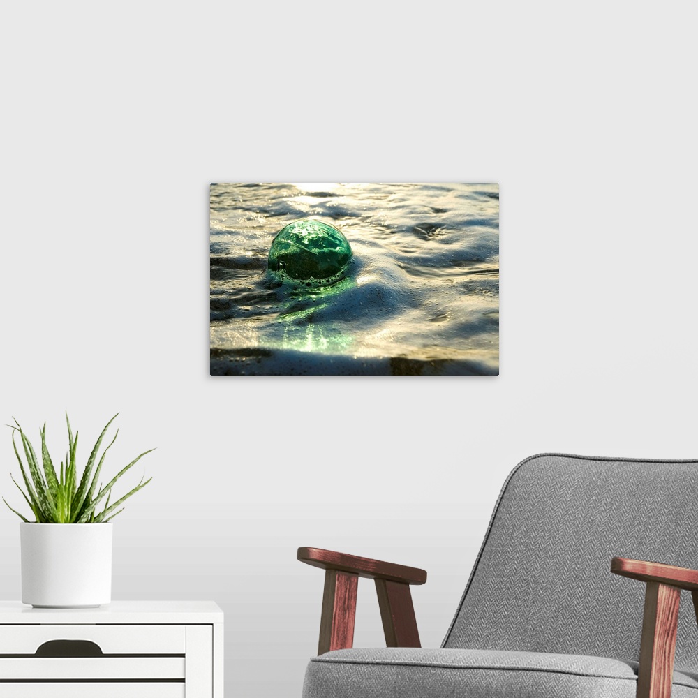 A Glass Fishing Ball Floats in Shallow Water | Large Metal Wall Art Print | Great Big Canvas