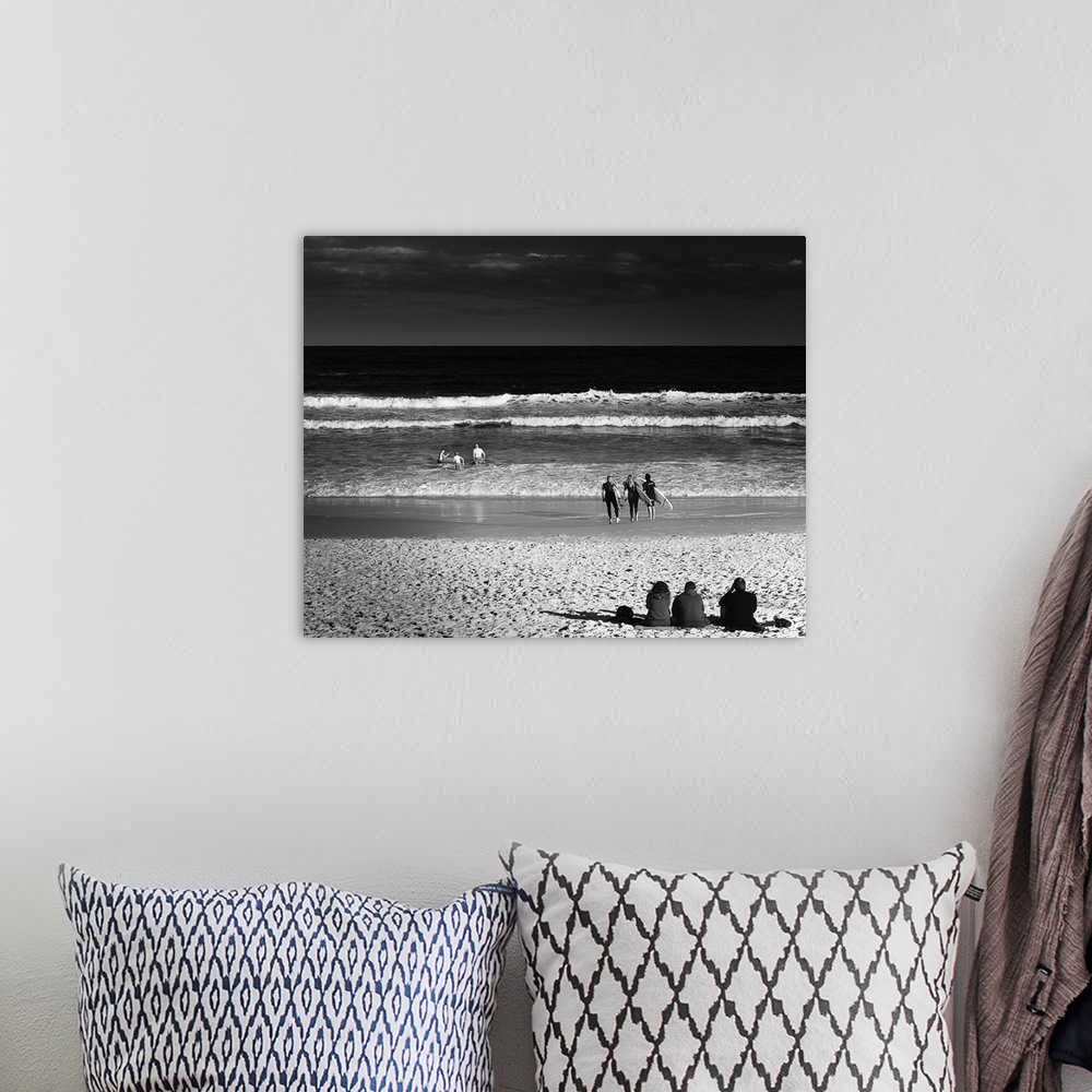 A bohemian room featuring Square black and white photograph of people in groups of 3 enjoying the beach in different ways, ...
