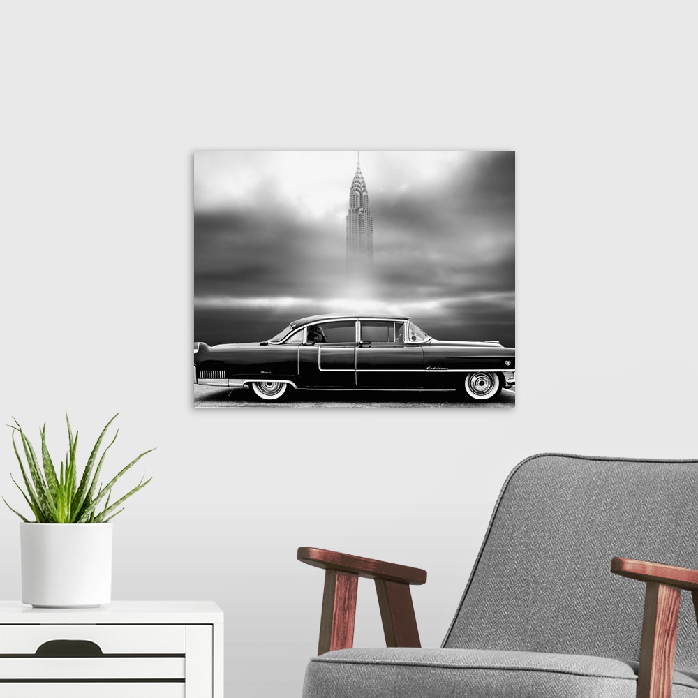 A modern room featuring Square black and white photograph of a parked vintage Chrysler with a man in the backseat and the...