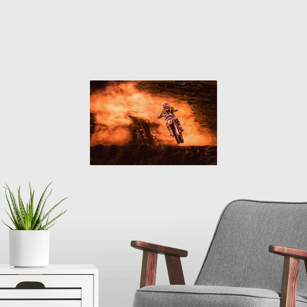 A modern room featuring A photograph of a motocross rider caught in the air while riding a dirt track.