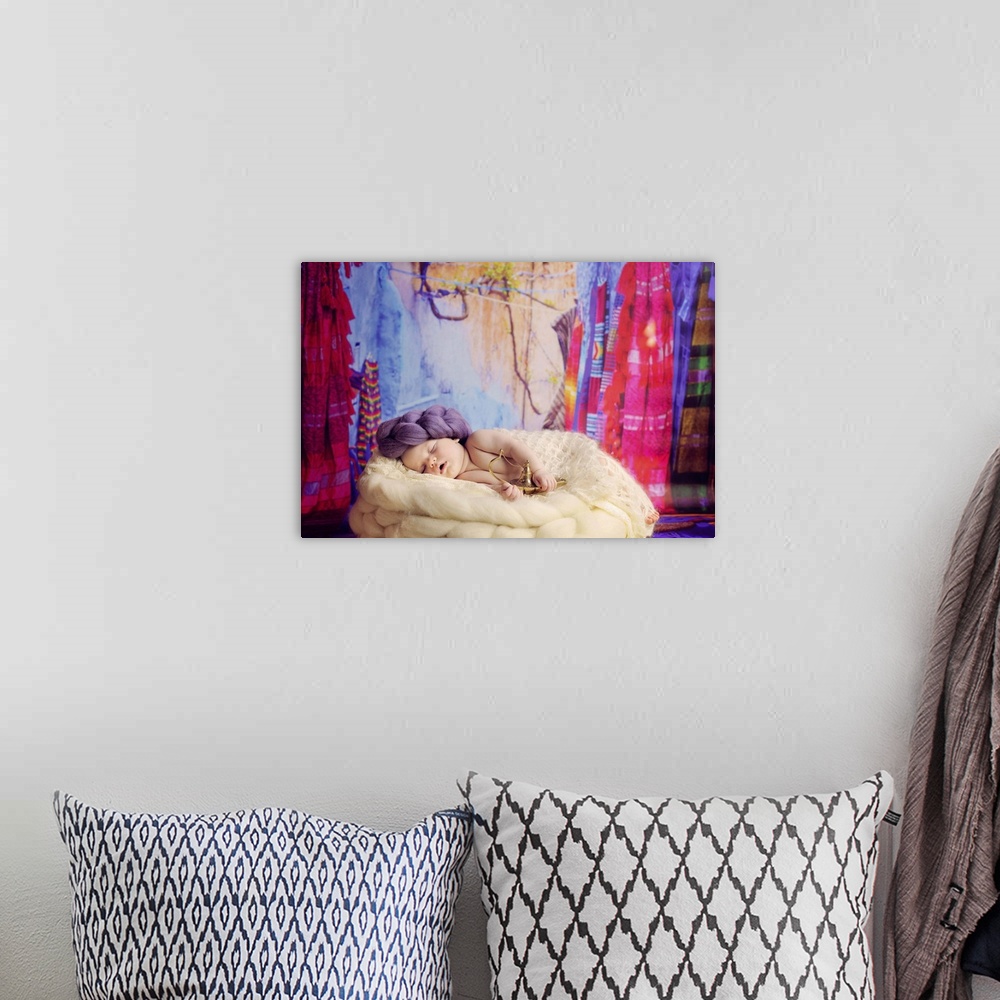 A bohemian room featuring Portrait of a newborn baby holding a genie's lamp and wearing a yarn turban.