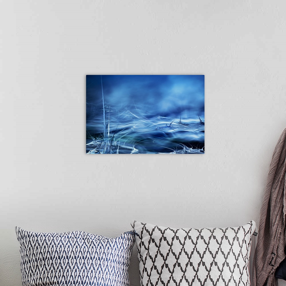 A bohemian room featuring Abstract digital art with blue, black, and white hues resembling moving water.