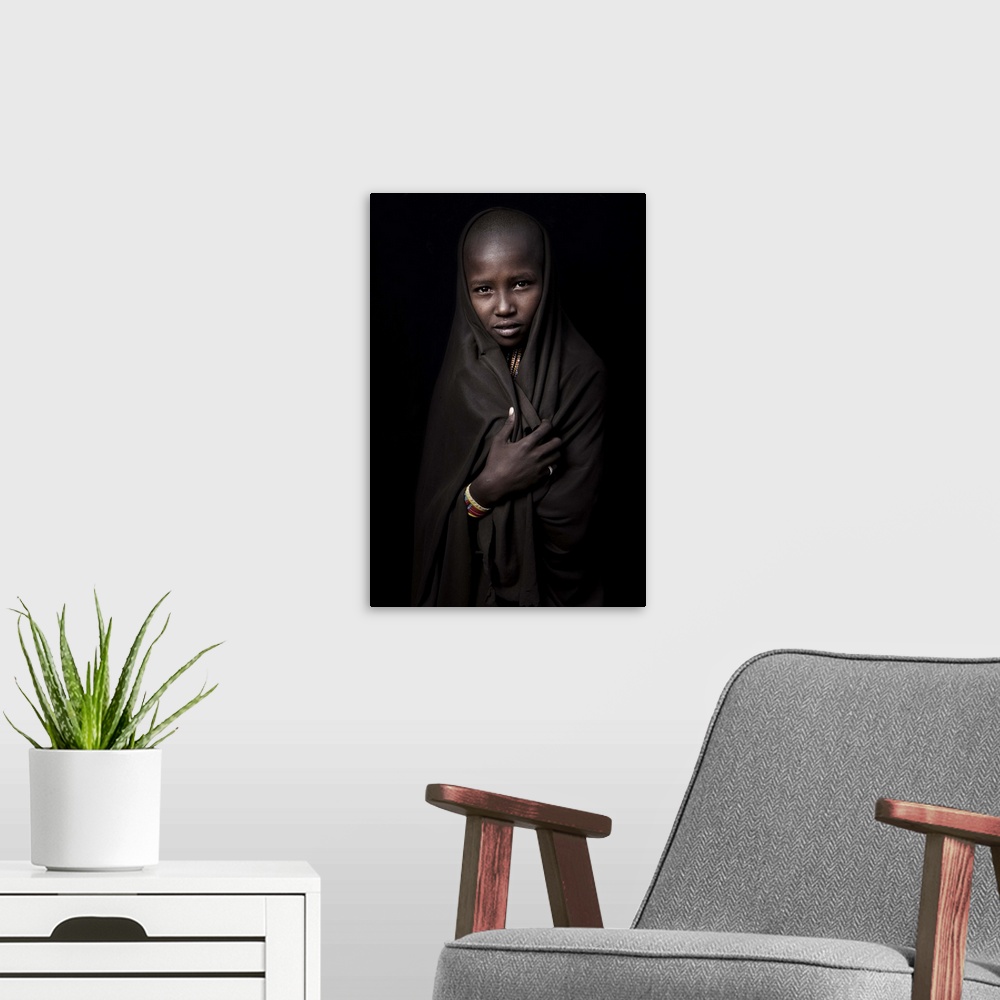 A modern room featuring Portrait of a young Ethiopian girl wearing a veil.