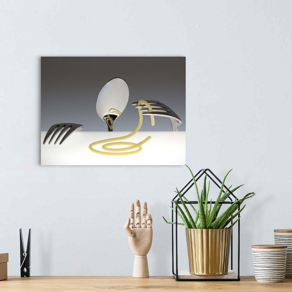 A bohemian room featuring Conceptual image of a spoon and two forks resembling a person, playing with spaghetti.