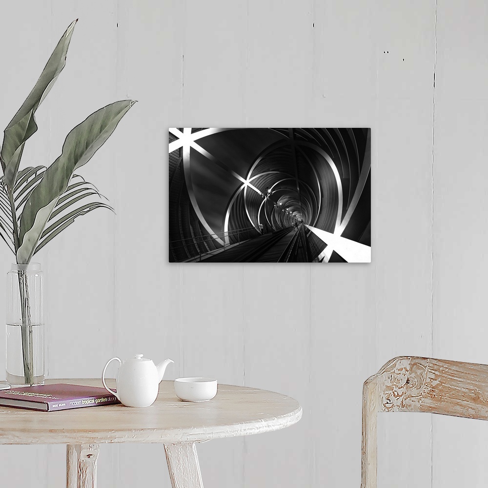 A farmhouse room featuring Black and white image of a tunnel with star-shaped beams in Madrid, Spain.