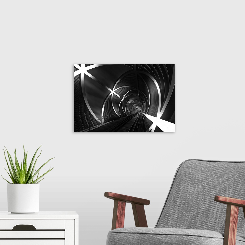 A modern room featuring Black and white image of a tunnel with star-shaped beams in Madrid, Spain.