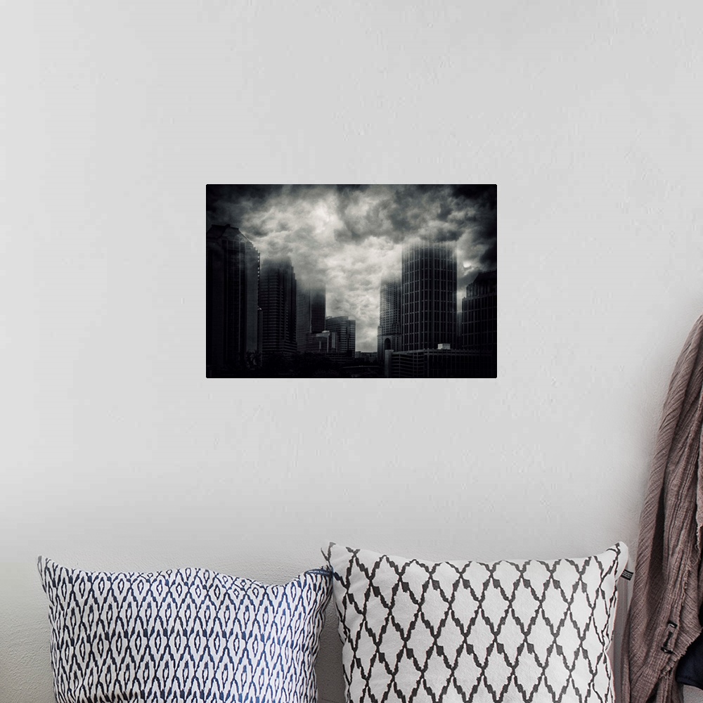A bohemian room featuring Conceptual image of storm clouds covering the tops of skyscrapers in Atlanta, Georgia.