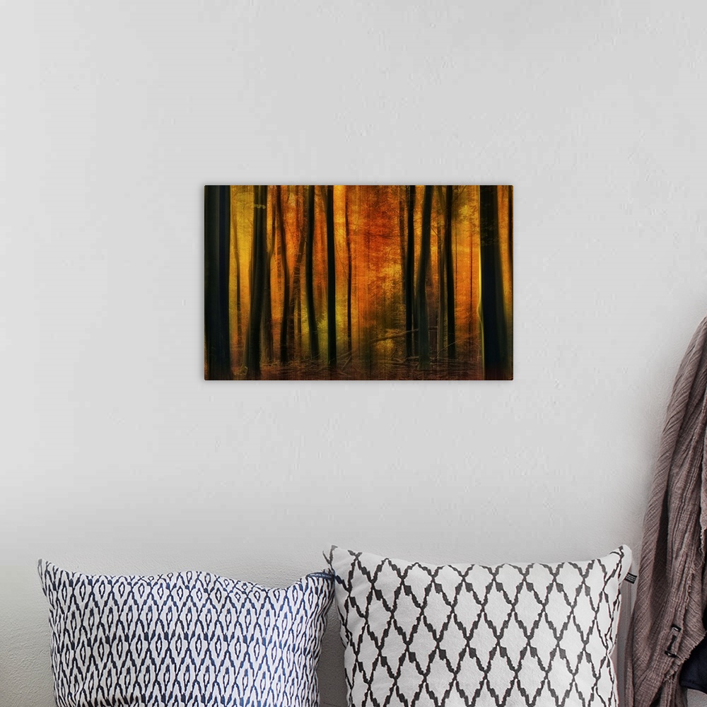 A bohemian room featuring An abstract scene of a warm autumn forest.