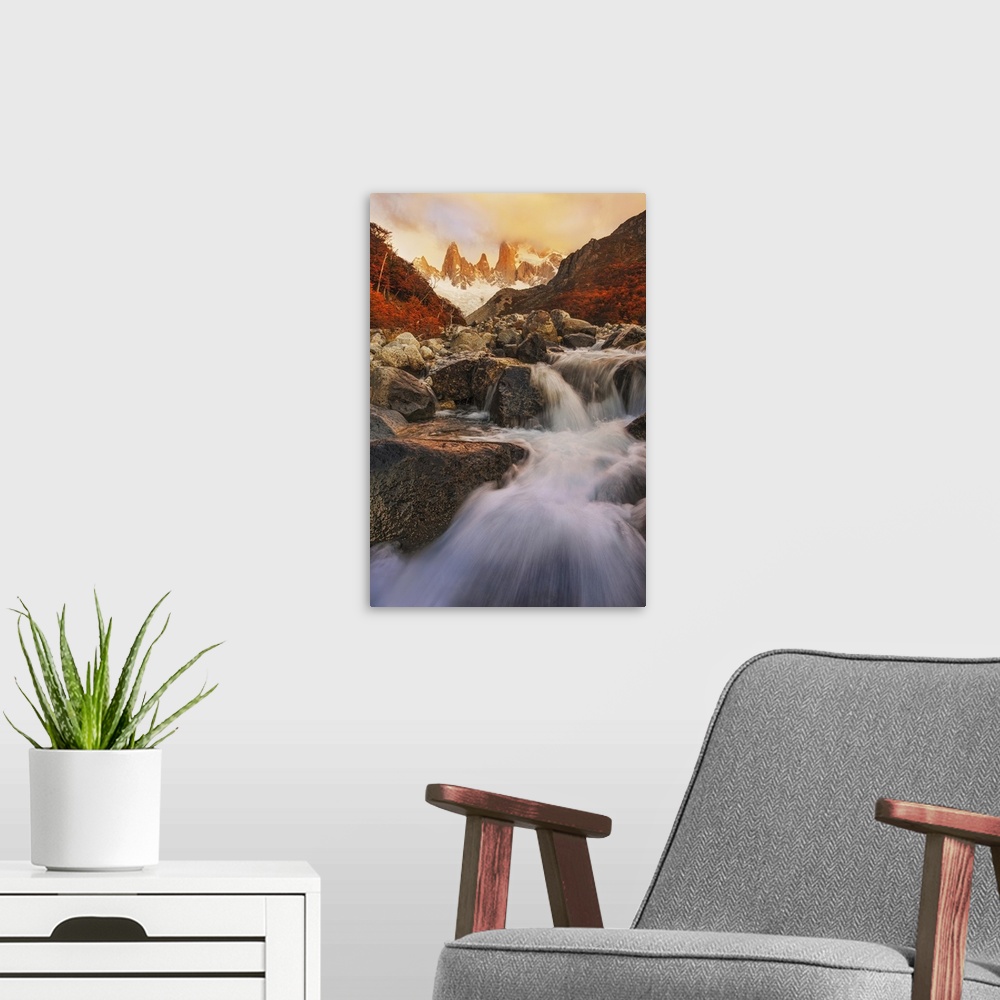 A modern room featuring Rushing waterfalls down the rocky landscape of Mount Fitzroy, Patagonia.