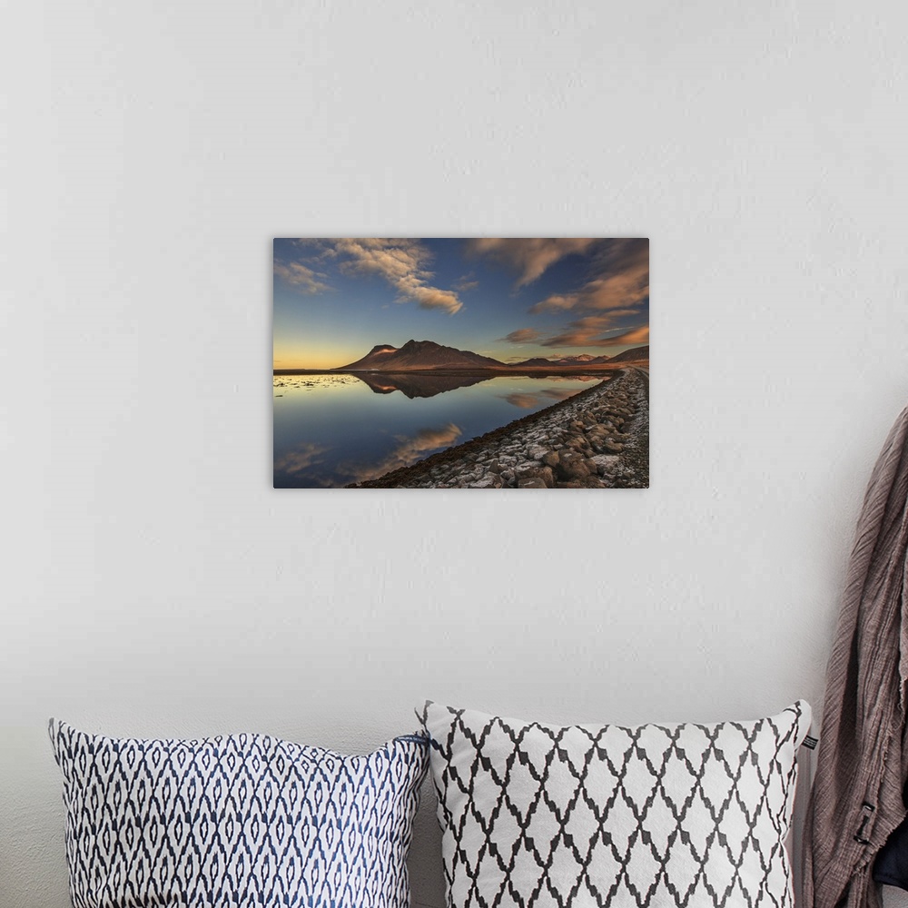 A bohemian room featuring Early evening view of Bjarnarhafnarfjall mountain reflected in calm water, Snaefellsnes peninsula...