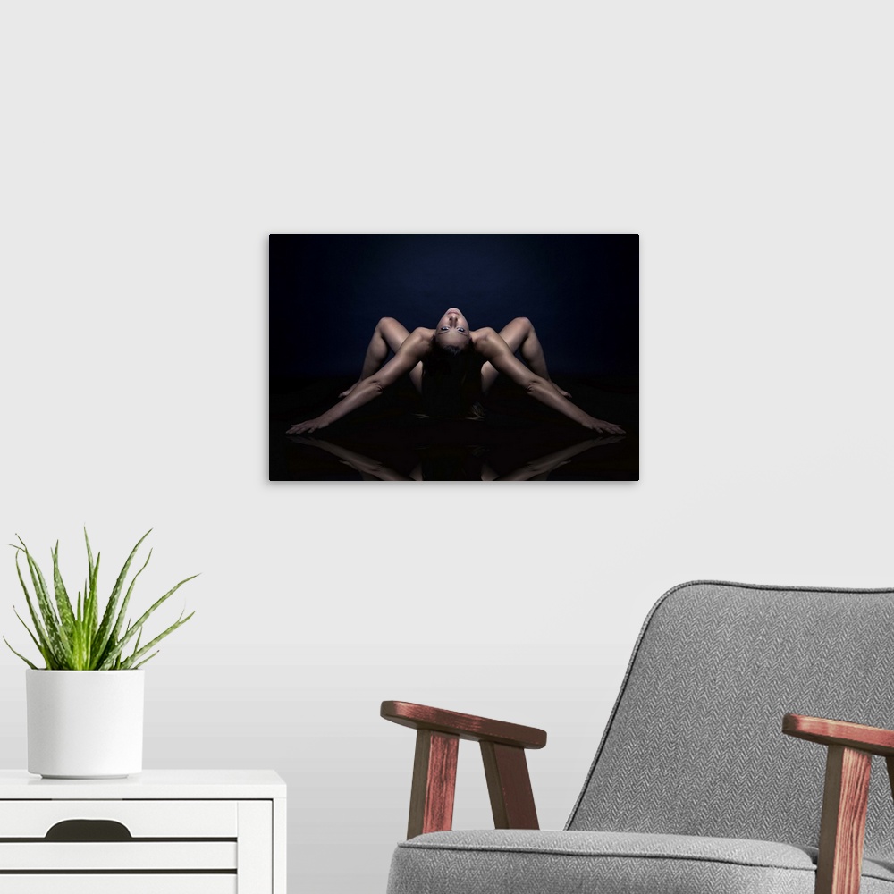 A modern room featuring Nude portrait of a woman bending over backwards.