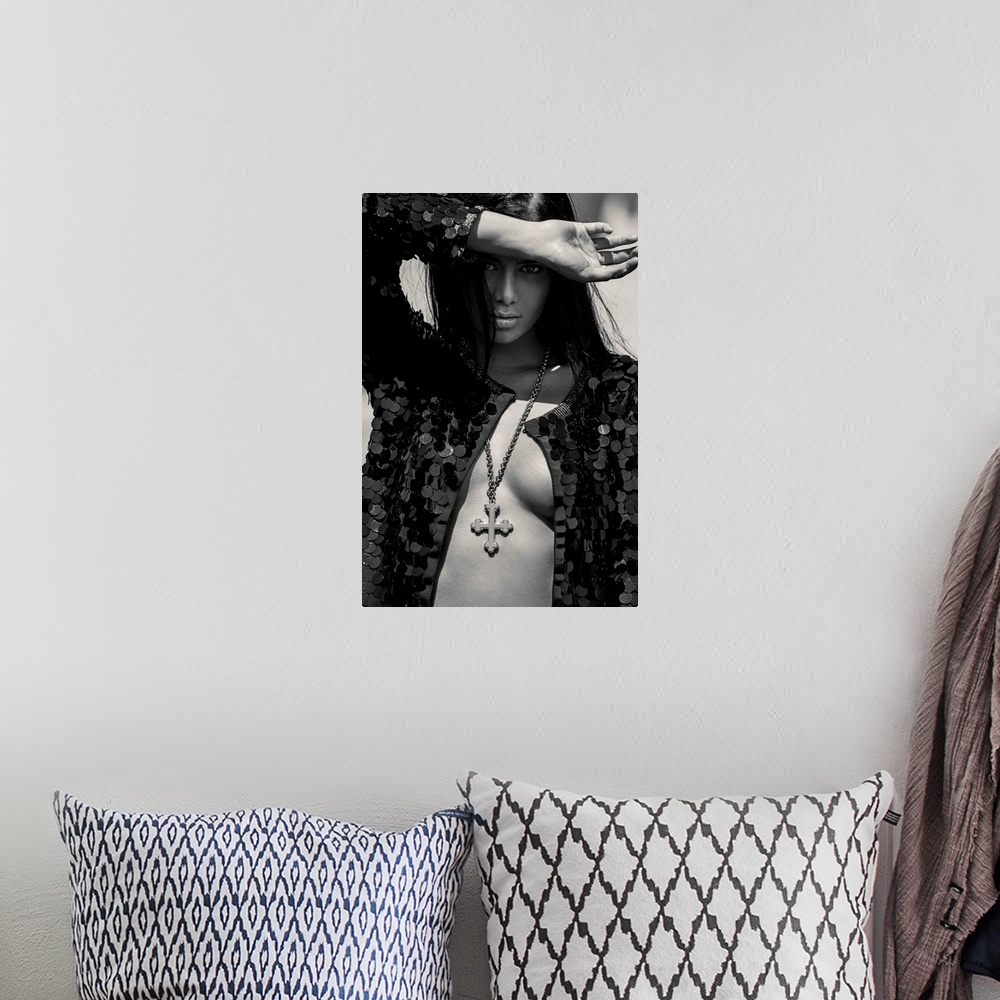 A bohemian room featuring Black and white portrait of a nude woman wearing a black sequin jacket and a cross necklace.