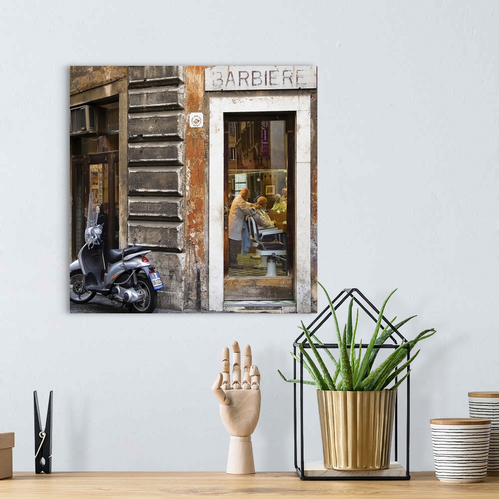 A bohemian room featuring A scooter outside of a barbershop in Italy.