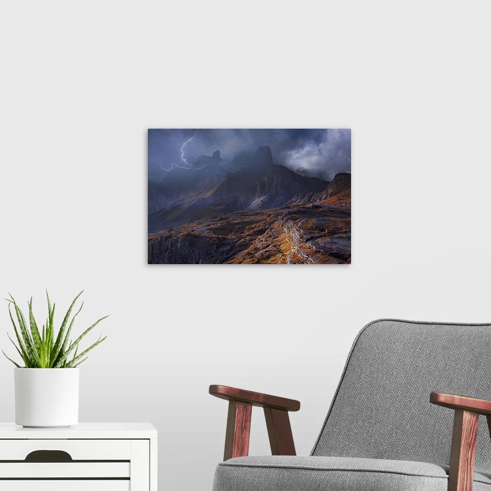 A modern room featuring Fog shrouded mountainous landscape surrounded by striking lightning.