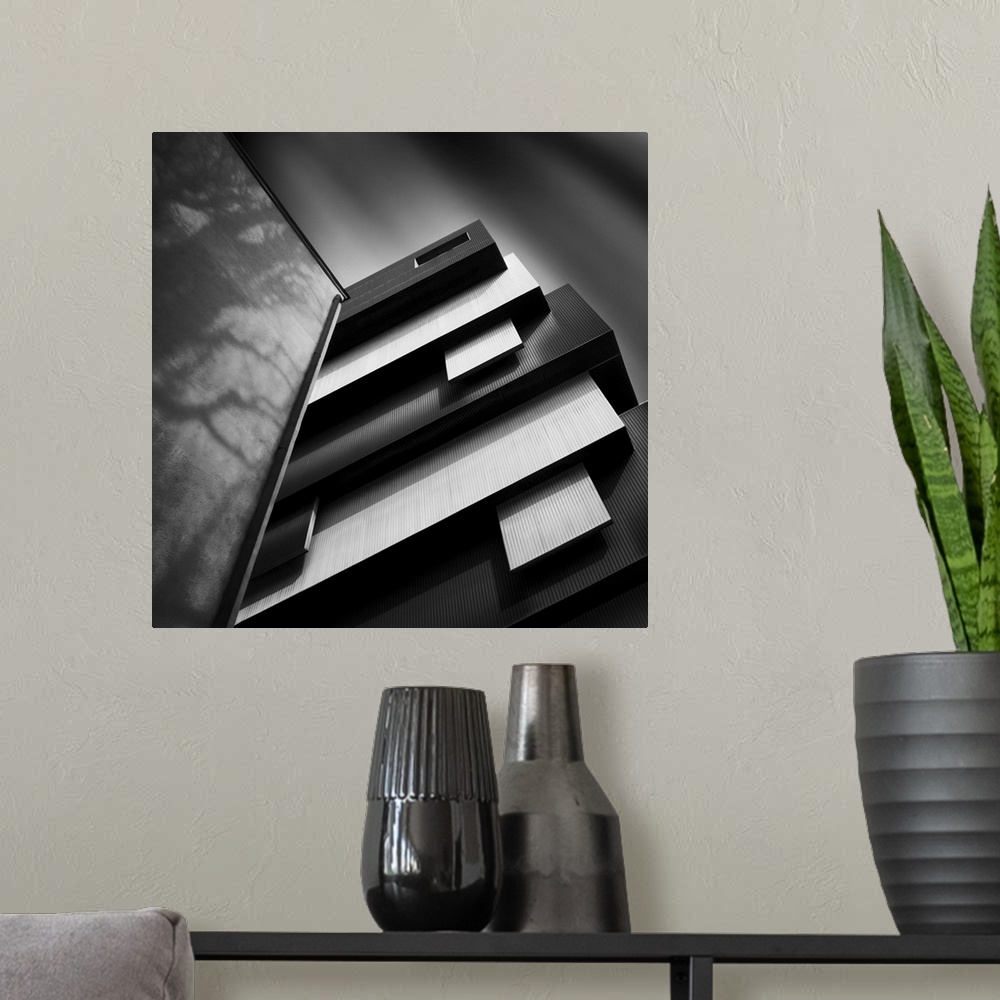 A modern room featuring Black and white photo of decorative architecture, creating an abstract image.