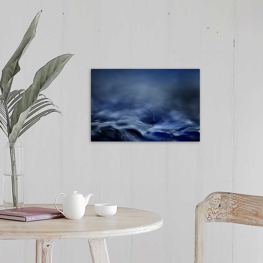 A farmhouse room featuring Abstract digital art resembling  a moving water landscape.