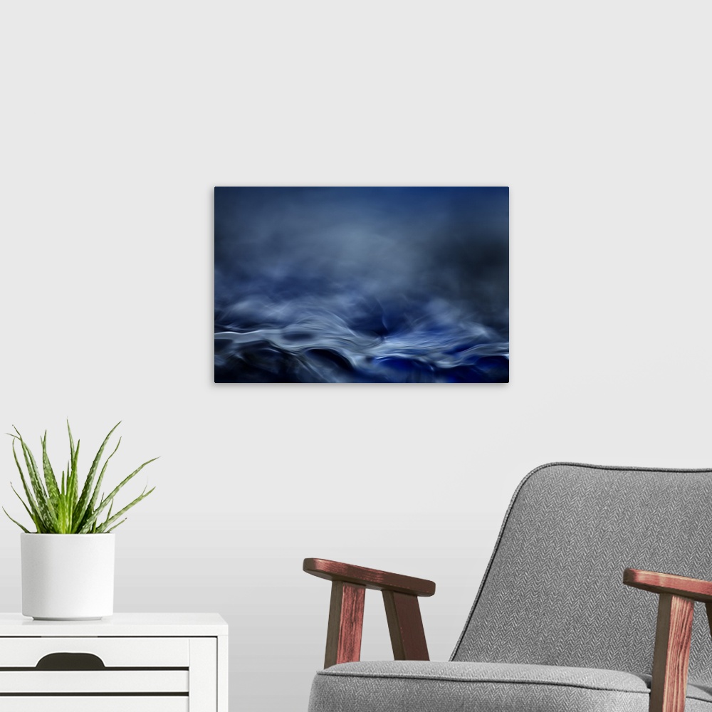 A modern room featuring Abstract digital art resembling  a moving water landscape.