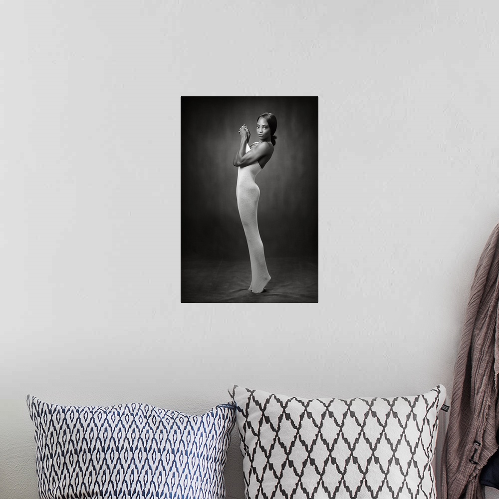 A bohemian room featuring Elegant black and white photograph of a nude woman wearing a tight body sock.