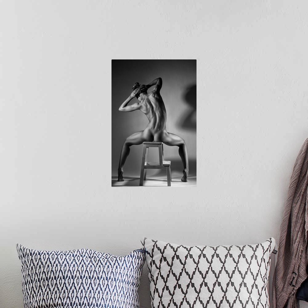 A bohemian room featuring Black and white fine art photograph of a woman with her back to us, sitting in a chair and creati...