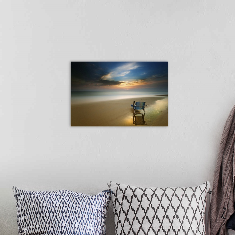 A bohemian room featuring Long exposure seascape photograph of a beach chair on the shore during sunset.