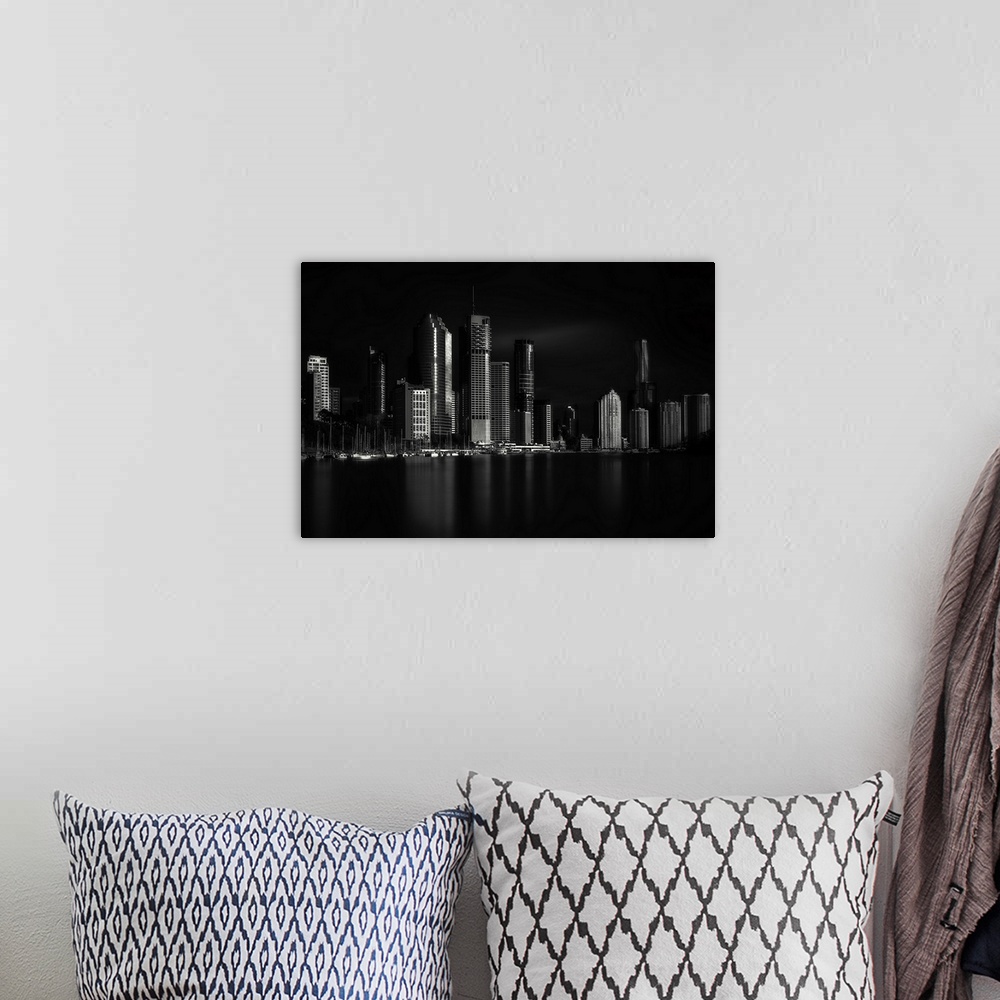 A bohemian room featuring A black and white photograph of the Brisbane skyline in Australia.